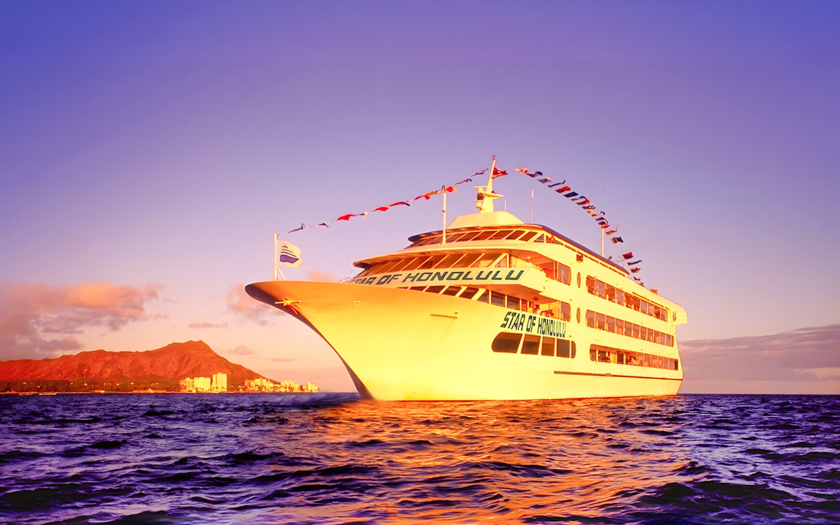 Cruise ship sailing near Diamond Head, Honolulu at sunset.