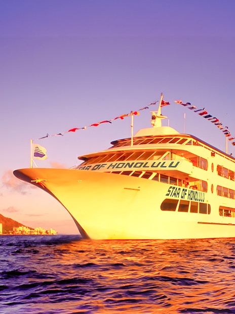 Cruise ship sailing near Diamond Head, Honolulu at sunset.
