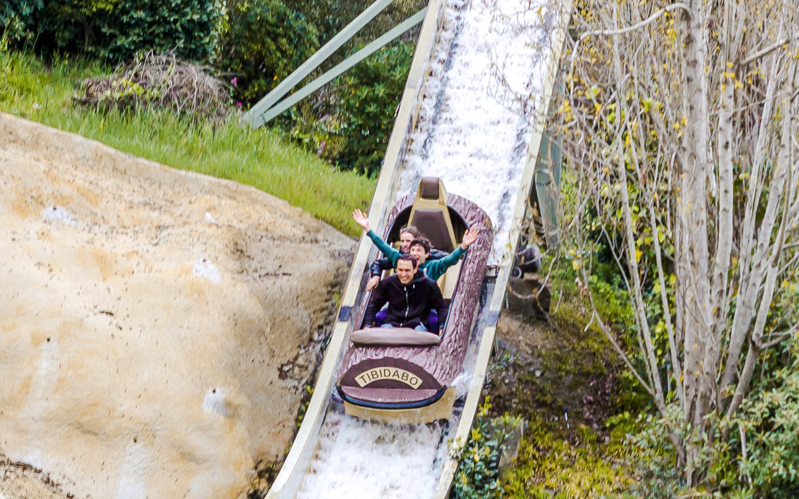 Visitors enjoying the Mina d'Or ride at Tibidabo Amusement Park, Barcelona.