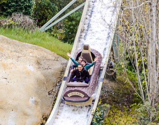 Visitors enjoying the Mina d'Or ride at Tibidabo Amusement Park, Barcelona.