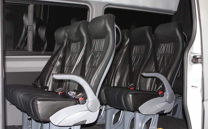 Minivan seats for transfer from Auckland to Hobbiton and Rotorua Te Puia guided tour.