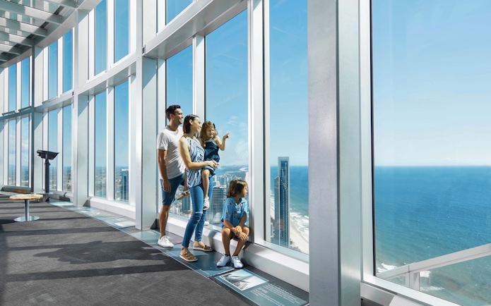 Family enjoying ocean views from SkyPoint Observation Deck, Gold Coast.