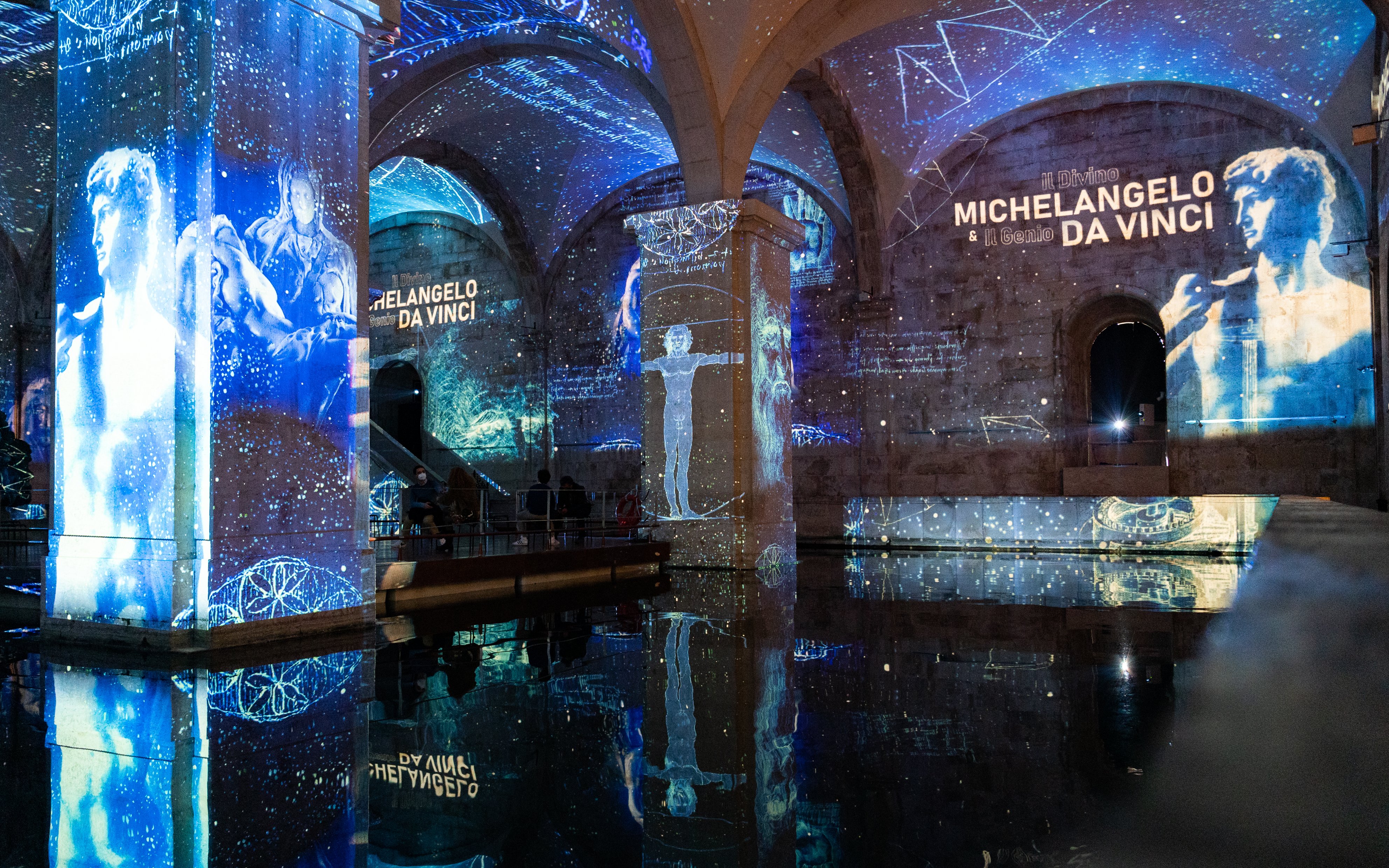 Visitors at Immersivus Gallery Lisbon viewing Michelangelo and Da Vinci light and sound show.