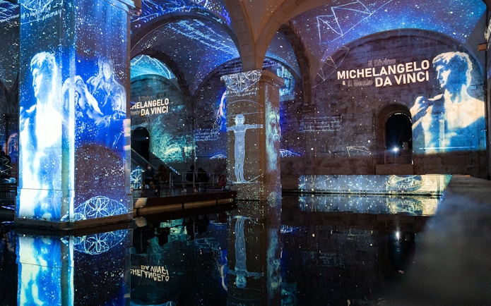 Visitors at Immersivus Gallery Lisbon viewing Michelangelo and Da Vinci light and sound show.