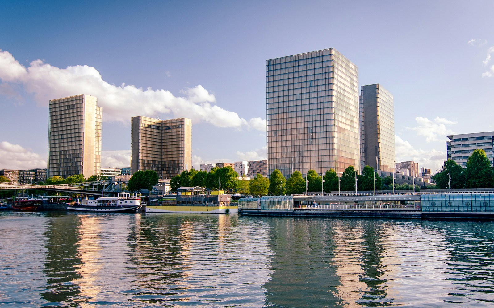 Bibliothèque Nationale de France viewed from the Seine River, showcasing its modern architecture in Paris.