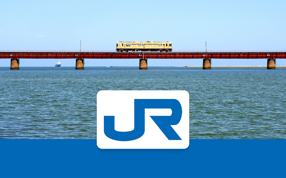 Train crossing a bridge over water in the Kansai-Hiroshima area, Japan.