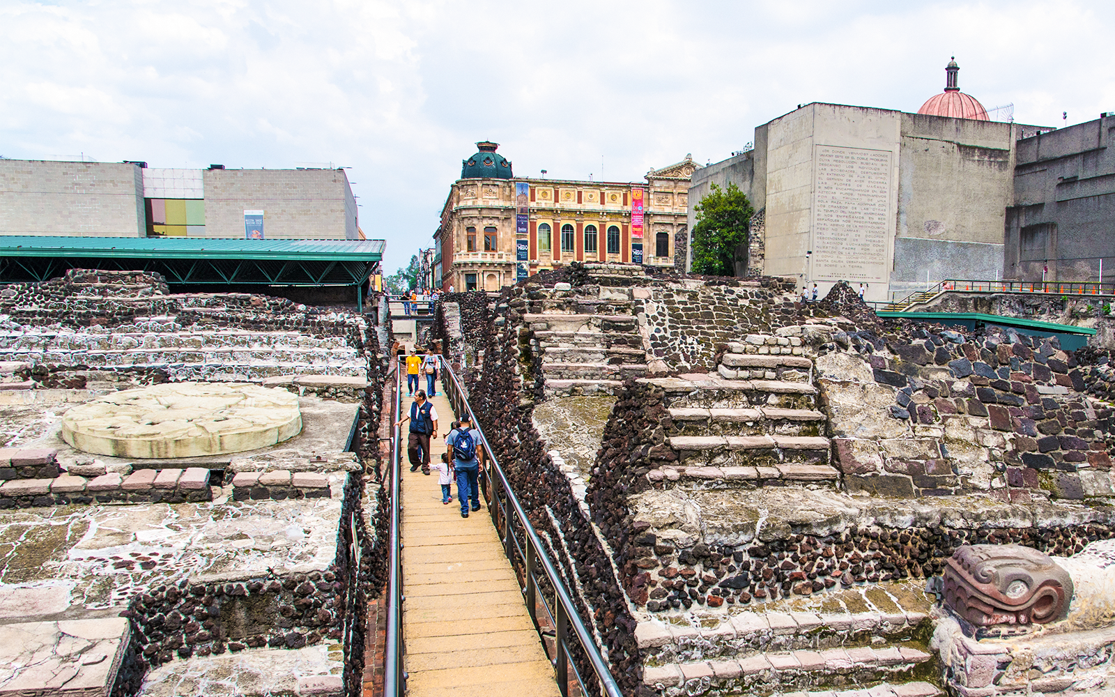 Visitors walking through Templo Mayor ruins in Mexico City.