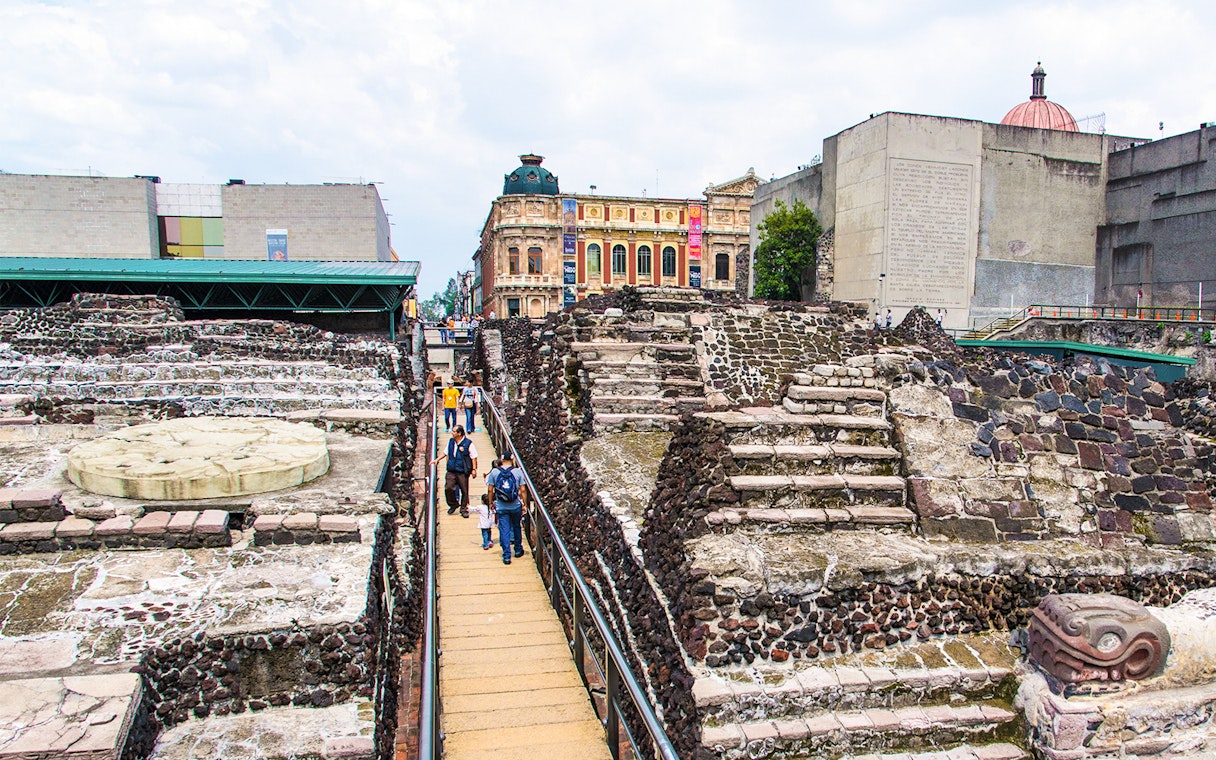 Visitors walking through Templo Mayor ruins in Mexico City.