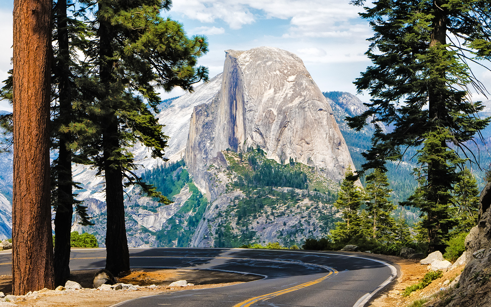 Winding road to Glacier Point with Half Dome view in Yosemite National Park.