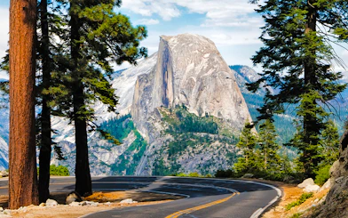 Winding road to Glacier Point with Half Dome view in Yosemite National Park.