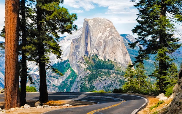 Winding road to Glacier Point with Half Dome view in Yosemite National Park.