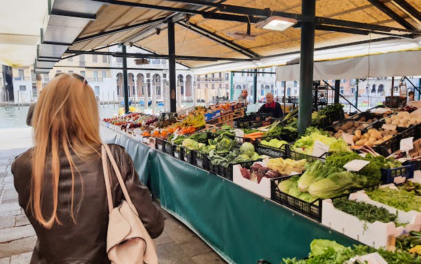 Venice market with fresh produce on a guided culinary walking tour.