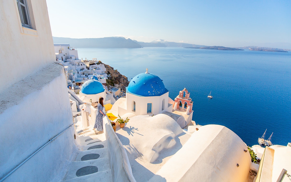 Santorini blue domes and sea view during Oia sunset tour.