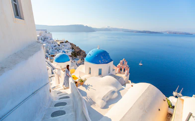 Santorini blue domes and sea view during Oia sunset tour.