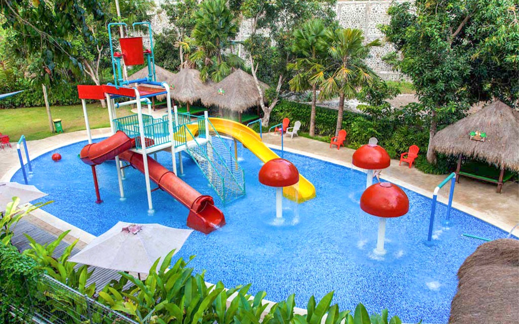 Children's water play area with slides at Bali Zoo.