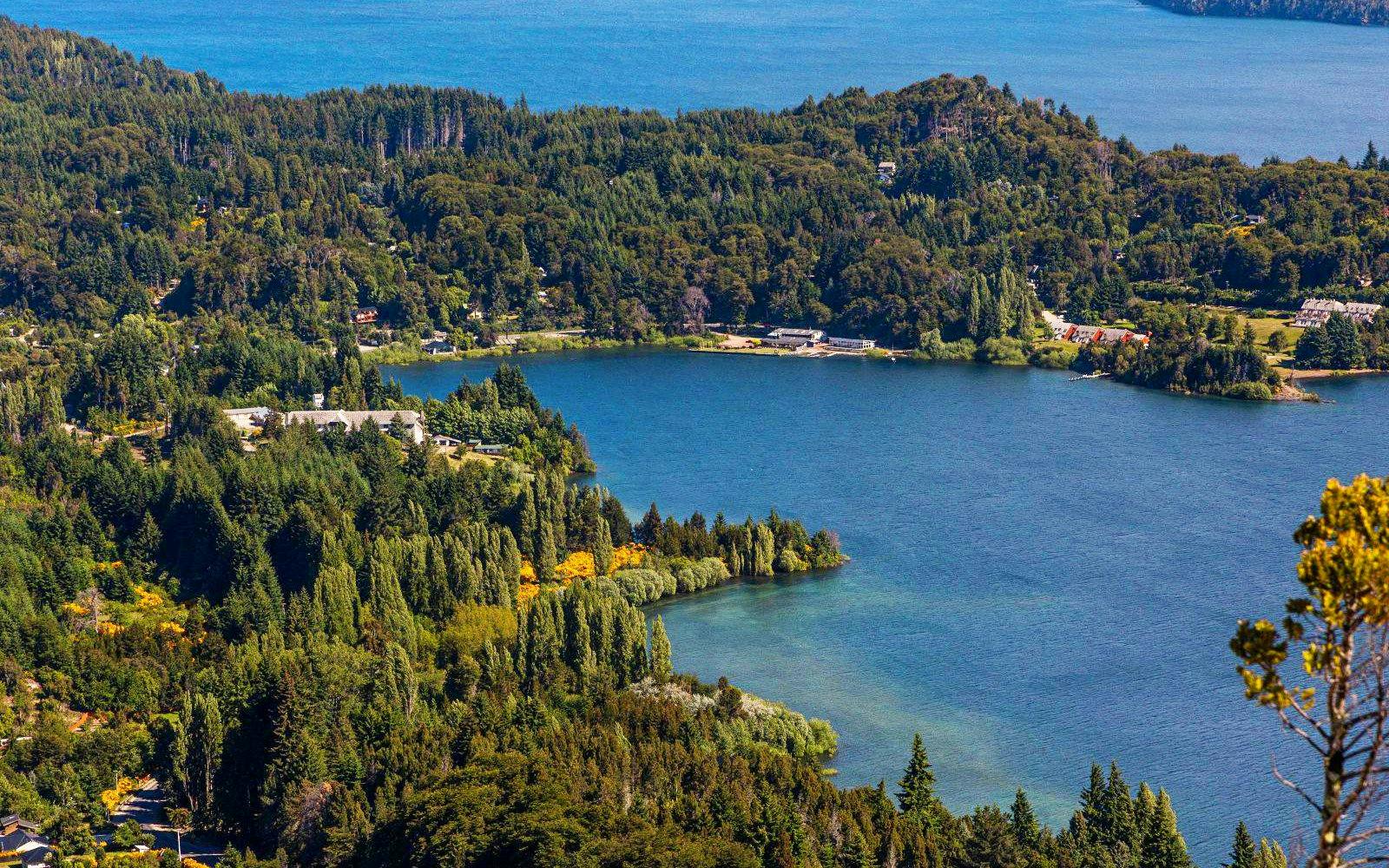 Tranquil lake with surrounding forests along the Small Circuit near Bariloche.