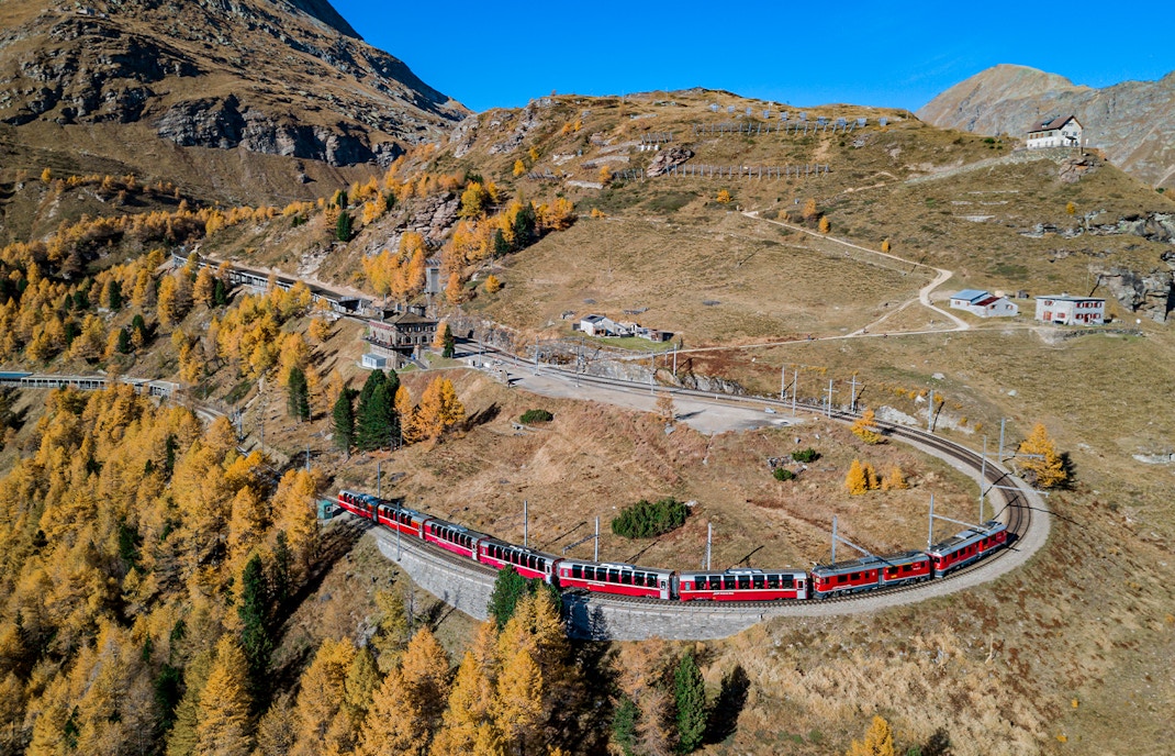 train passing through high passes near tirano