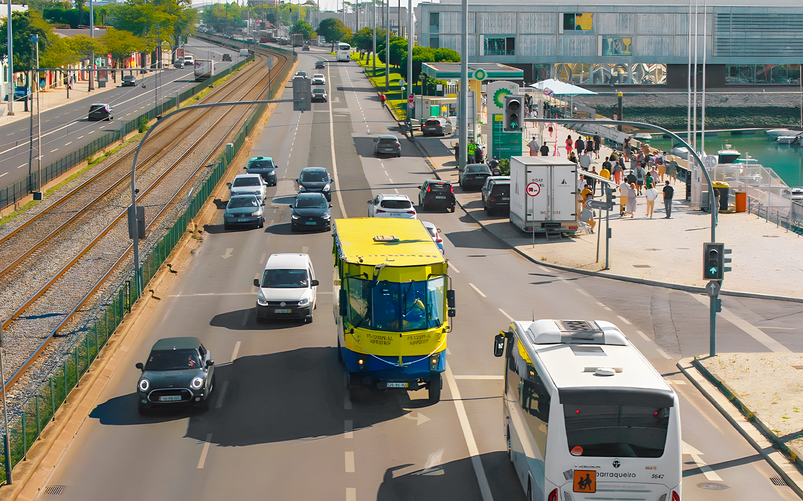 HIPPOtrip vehicle driving on a city road alongside cars and a tram line.