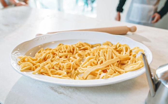 Fresh pasta on a plate during a cooking class.
