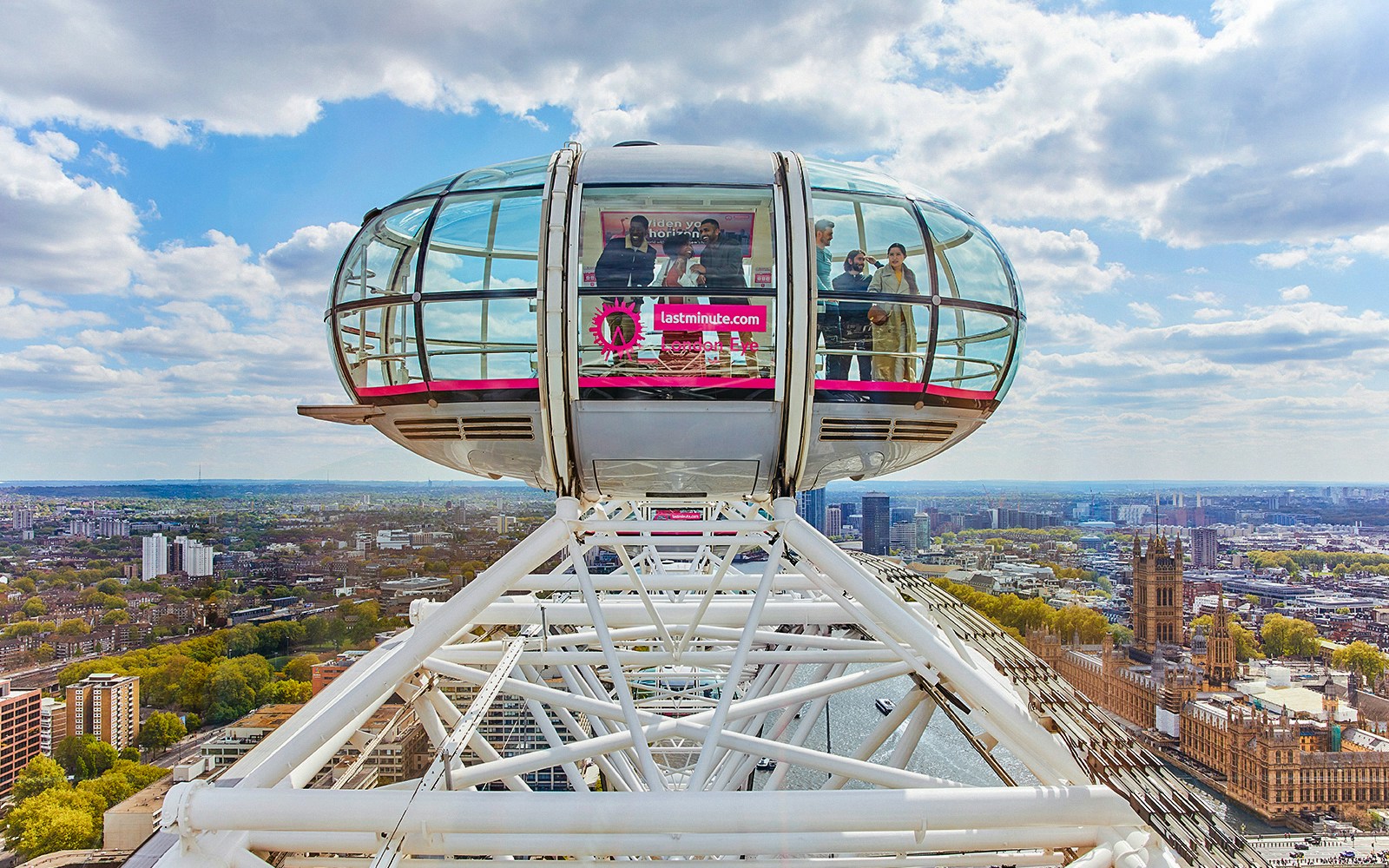 London Eye capsule overlooking Thames River and cityscape.