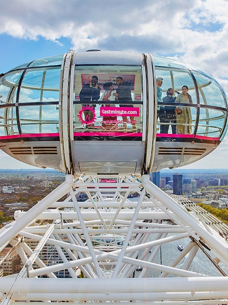 London Eye capsule overlooking Thames River and cityscape.