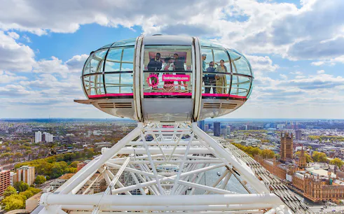 London Eye capsule overlooking Thames River and cityscape.