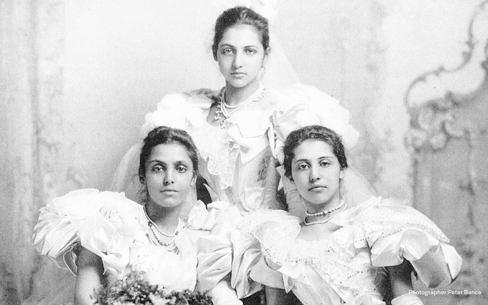 Three women in Victorian dresses at Kensington Palace's Last Princesses of Punjab exhibition.