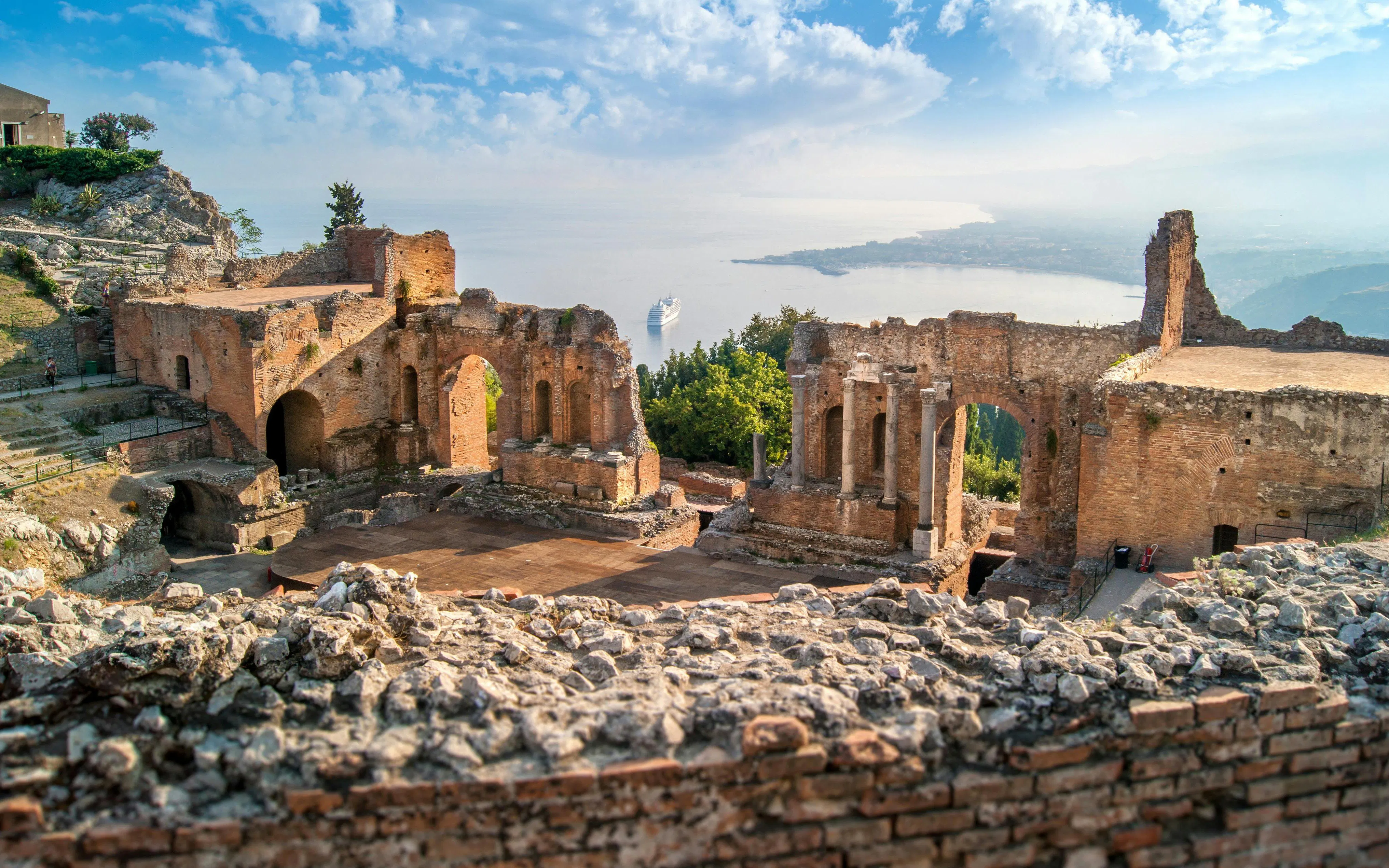 Greek theatre ruins overlooking the sea in Taormina, Sicily, Italy.