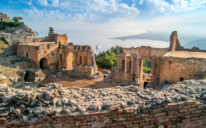 Greek theatre ruins overlooking the sea in Taormina, Sicily, Italy.