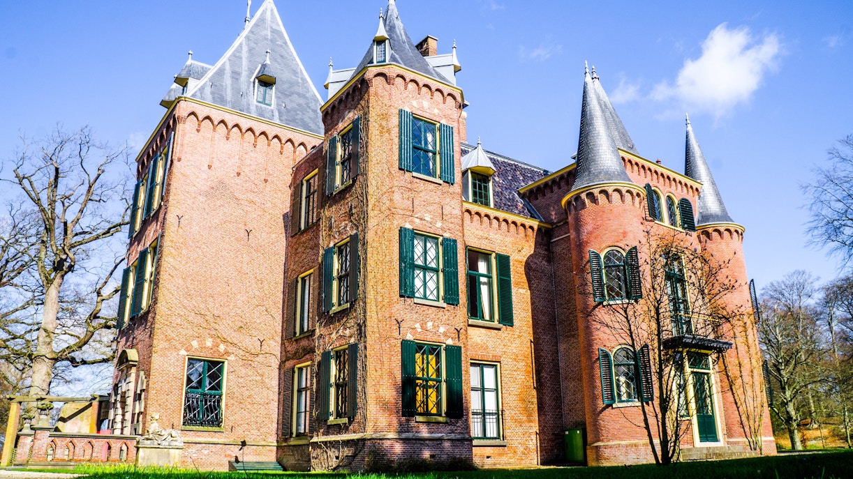 Keukenhof Castle exterior with brick facade and pointed towers in Lisse, Netherlands.