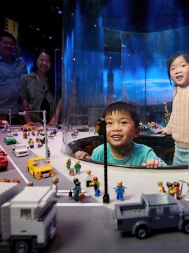 Children enjoying a LEGO city exhibit during a school holiday special in Melbourne.