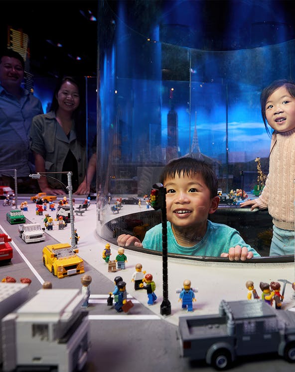 Children enjoying a LEGO city exhibit during a school holiday special in Melbourne.