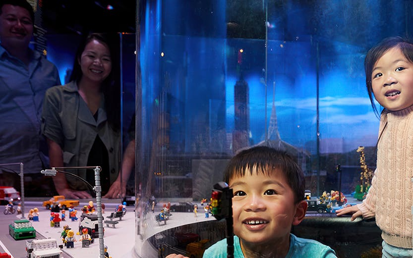 Children enjoying a LEGO city exhibit during a school holiday special in Melbourne.