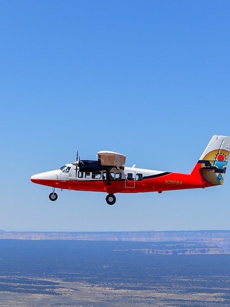 Airplane flying over desert landscape on Antelope Canyon tour from Las Vegas.