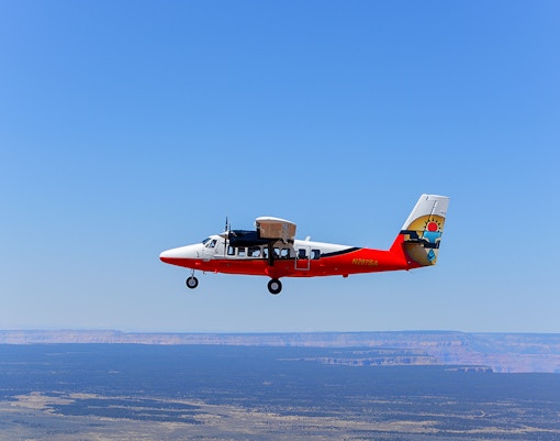 Airplane flying over desert landscape on Antelope Canyon tour from Las Vegas.