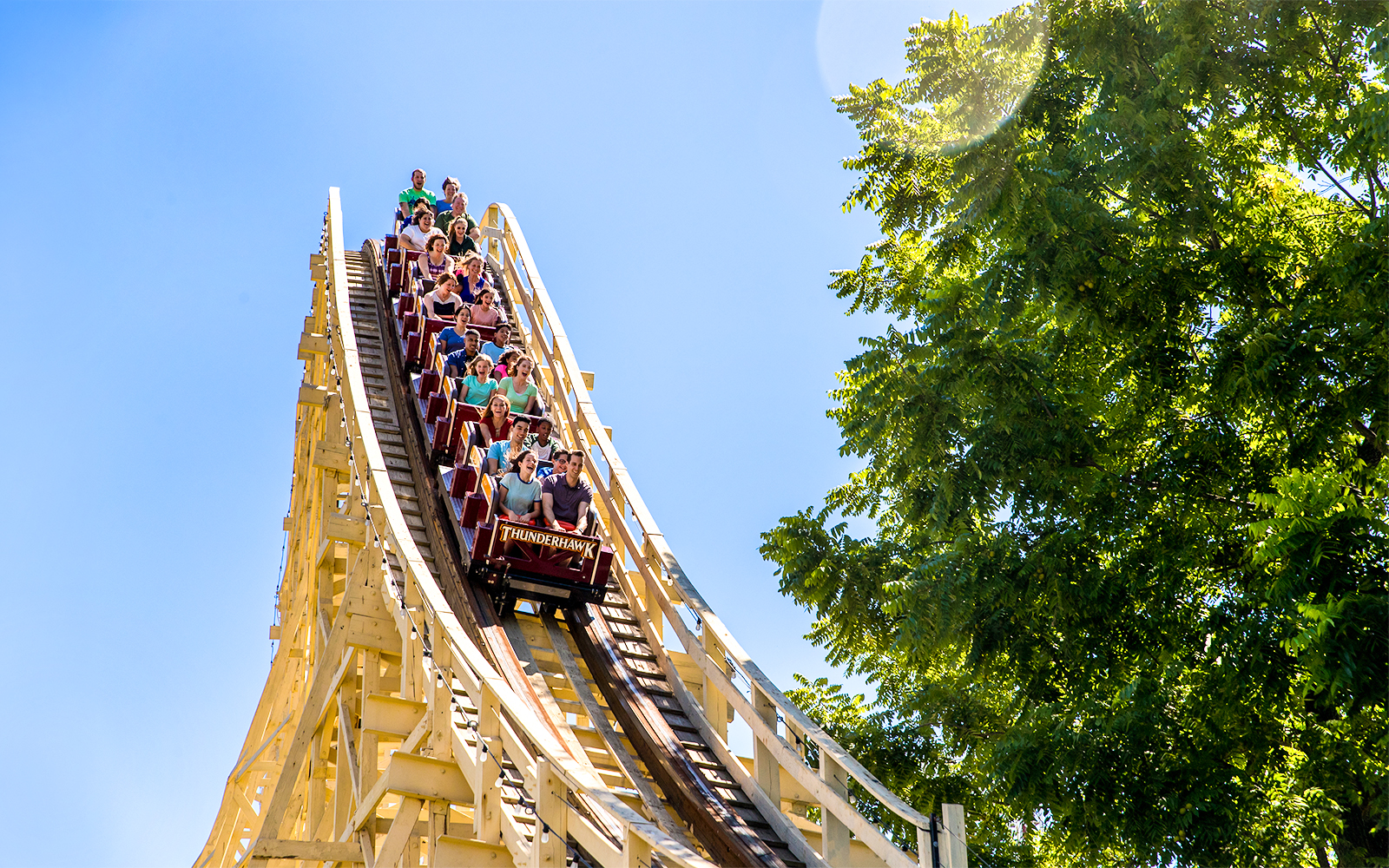 Thunderhawk roller coaster at Dorney Park with riders descending a steep drop.
