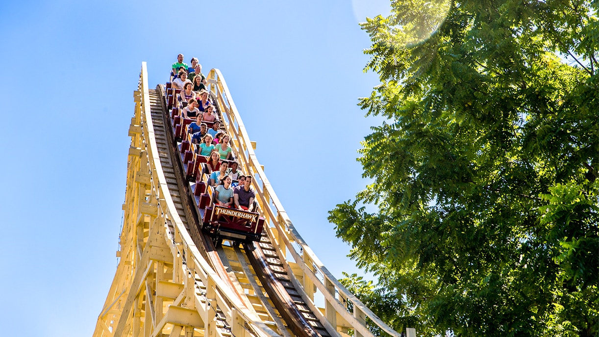 Thunderhawk roller coaster at Dorney Park with riders descending a steep drop.