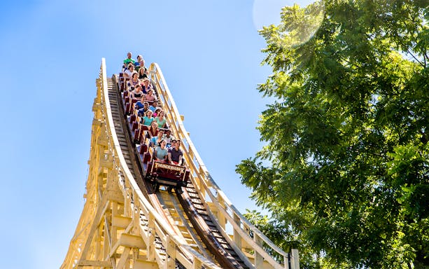 Thunderhawk roller coaster at Dorney Park with riders descending a steep drop.