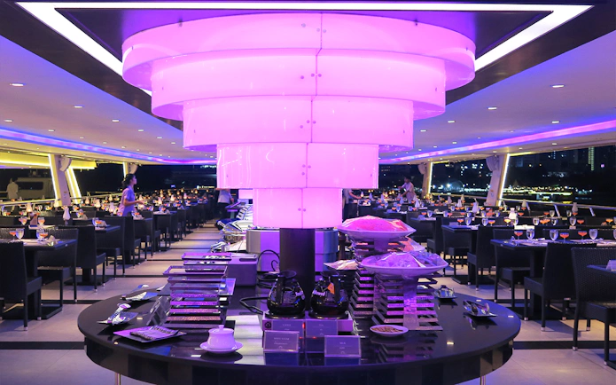 Chao Phraya Princess Cruise dining area with buffet setup and ambient lighting.