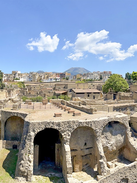 Ancient ruins of Herculaneum with Mount Vesuvius in the background, Italy.