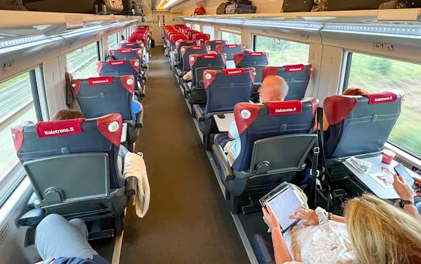 Passengers seated inside a high-speed Italo train from Florence to Venice.
