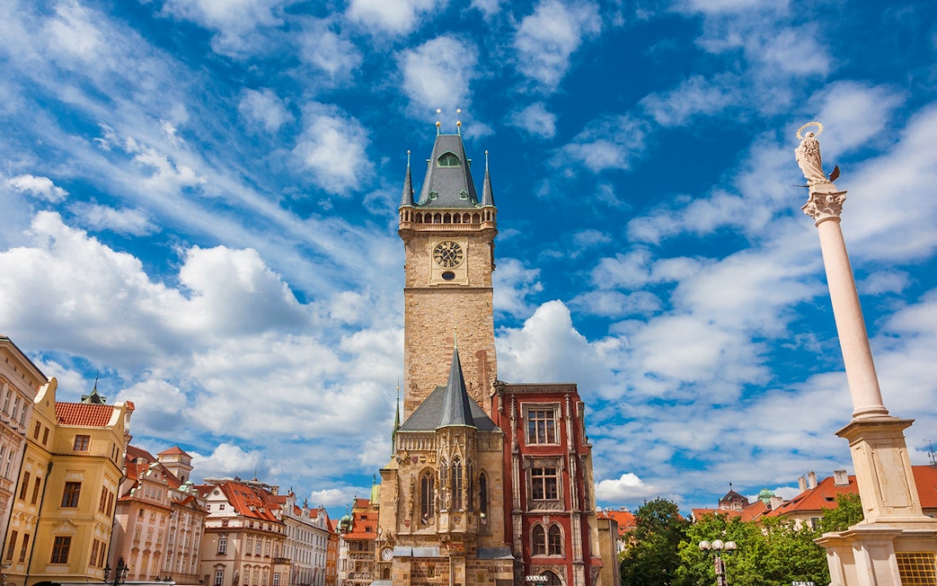 Old Town Hall medieval clock tower in Prague under a blue sky.