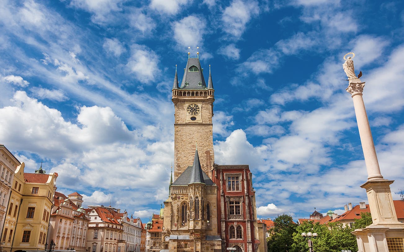 Old Town Hall medieval clock tower in Prague under a blue sky.