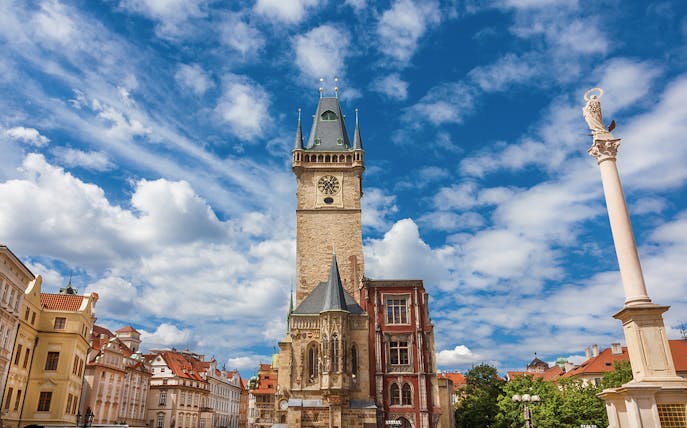 Old Town Hall medieval clock tower in Prague under a blue sky.