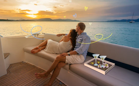 Couple relaxing on a yacht at sunset with cocktails, ideal for luxury travelers.