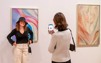 Guests viewing artwork at Whitney Museum of American Art.