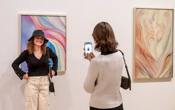 Guests viewing artwork at Whitney Museum of American Art.