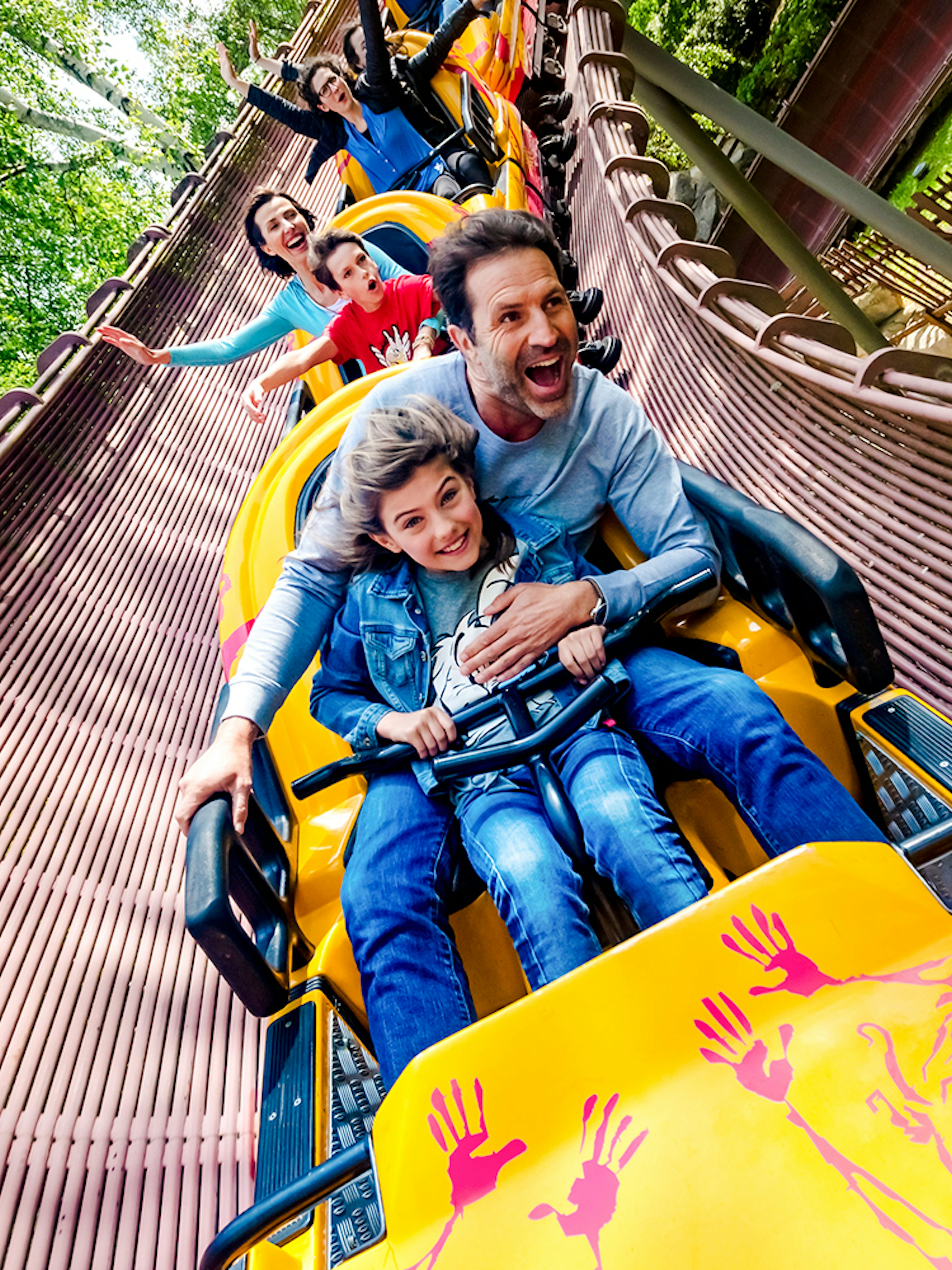 People enjoying a roller coaster ride at Parc Asterix, France.