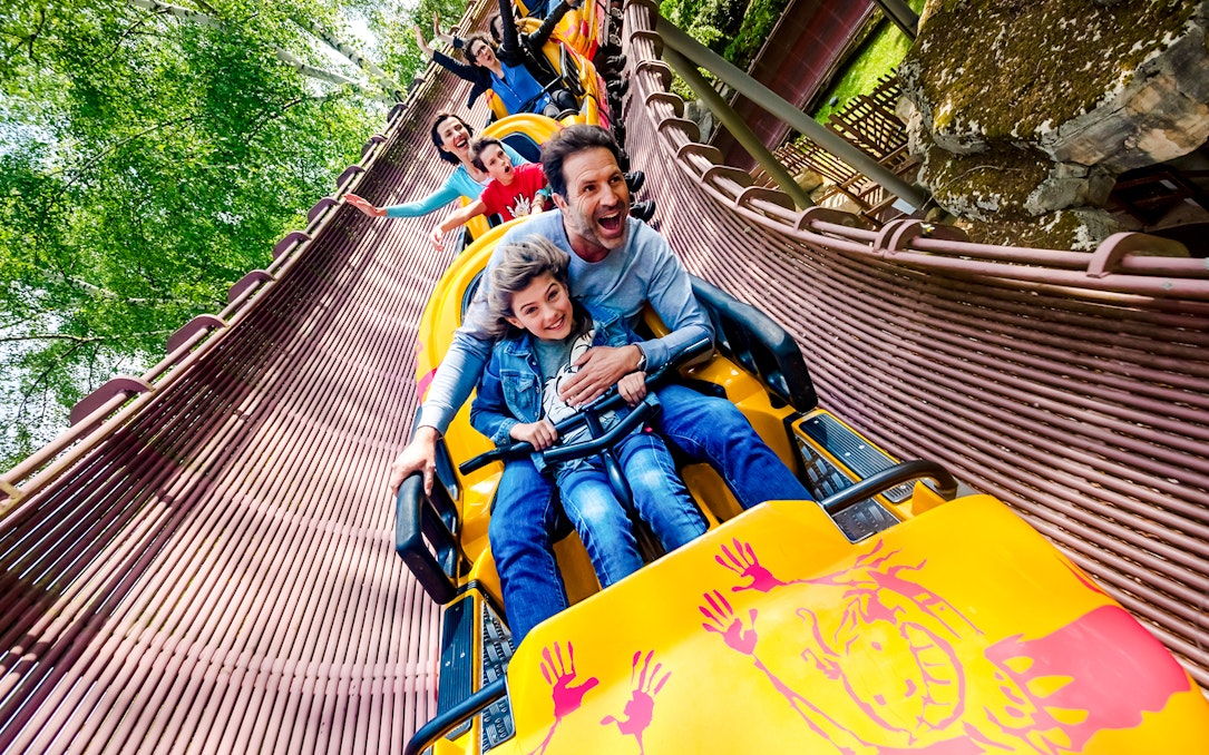 People enjoying a roller coaster ride at Parc Asterix, France.