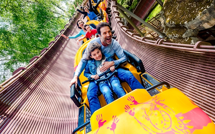 People enjoying a roller coaster ride at Parc Asterix, France.
